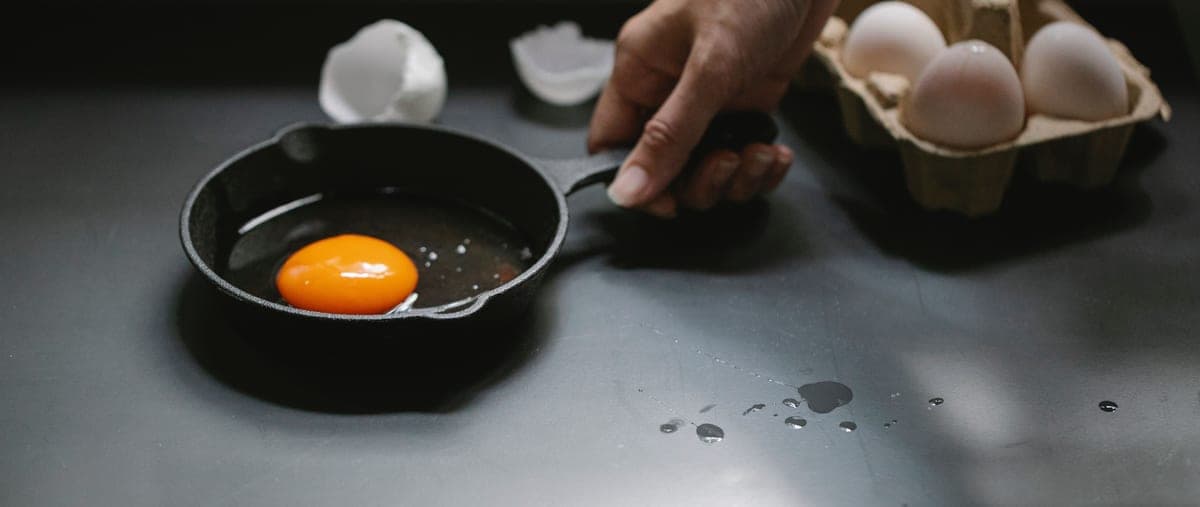 Enameled dutch oven and bare cast iron skillet side by side