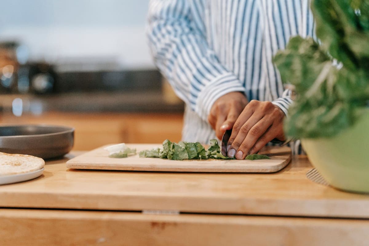 Thick wooden cutting board on a kitchen counter