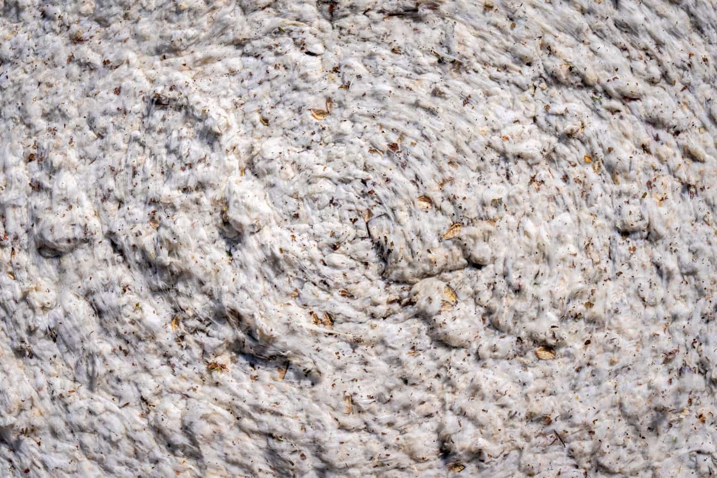 Close-up of woven organic cotton fabric showing the fiber texture