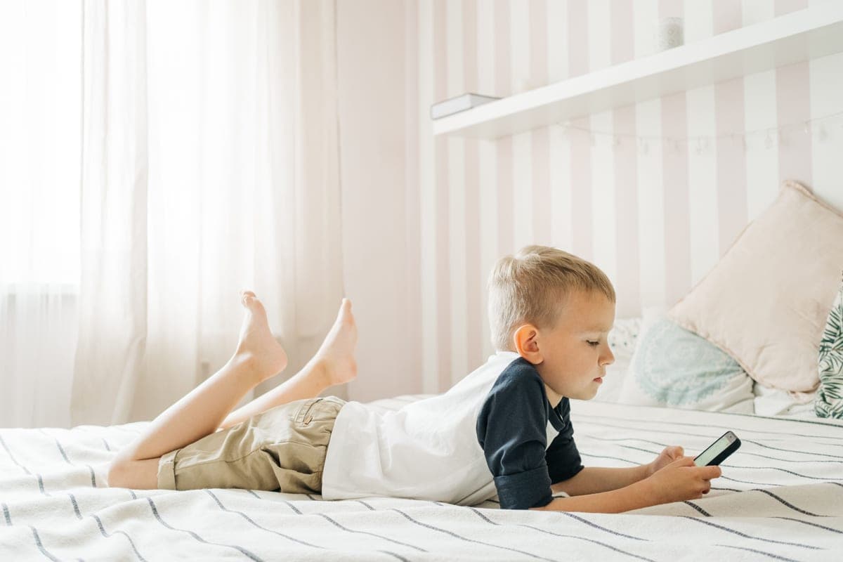 Minimal nursery room with a crib and plain walls