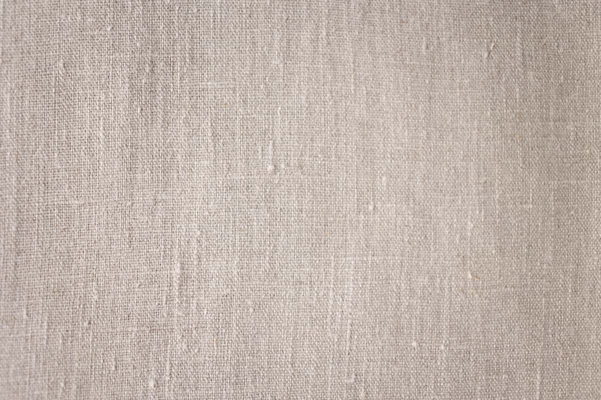 Textured linen fabric close up showing the weave