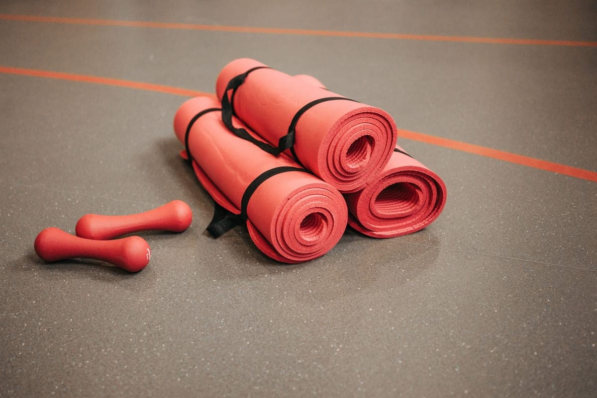 Rolled yoga mat standing upright